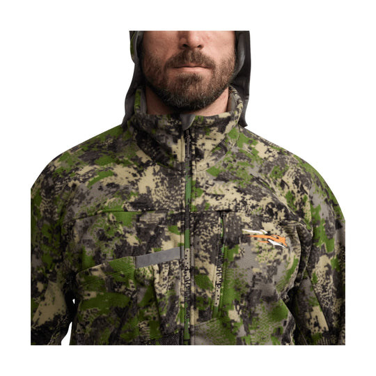 Camouflage zip-front hooded jacket with chest pockets and a small orange logo.