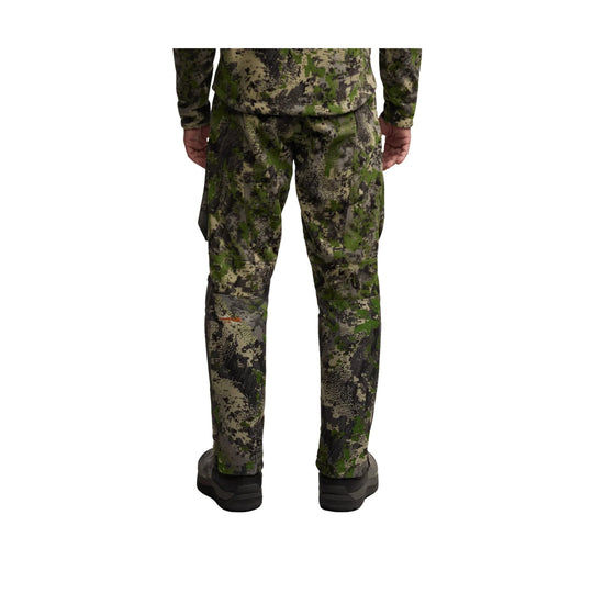 Camouflage pants shown from the back with black boots