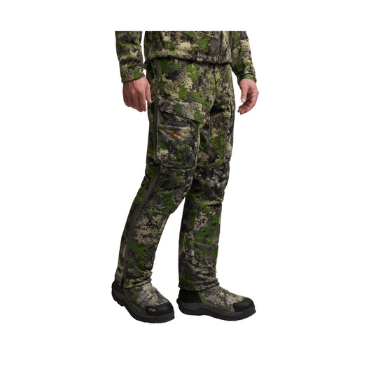 Camo cargo pants with zip side pockets and black boots, shown on a model