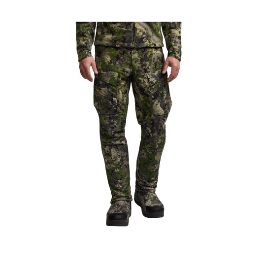 Camouflage cargo pants with matching boots on a white background