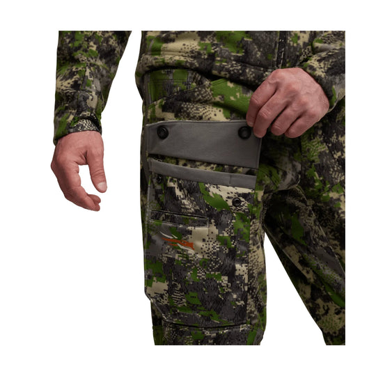 Camouflage cargo pants with gray thigh pocket and zippered knee pocket