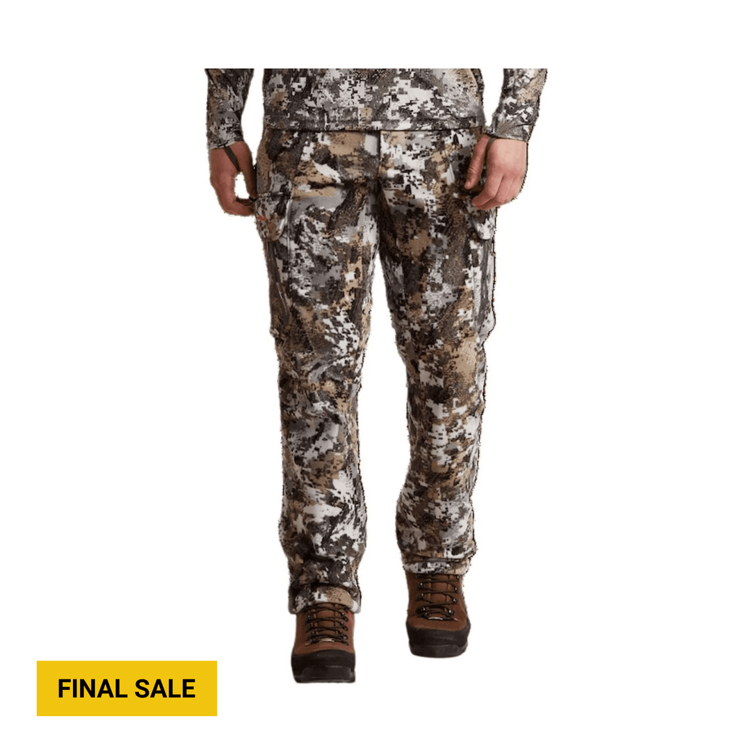 Camouflage cargo pants with a matching top and brown hiking boots; yellow label reads FINAL SALE