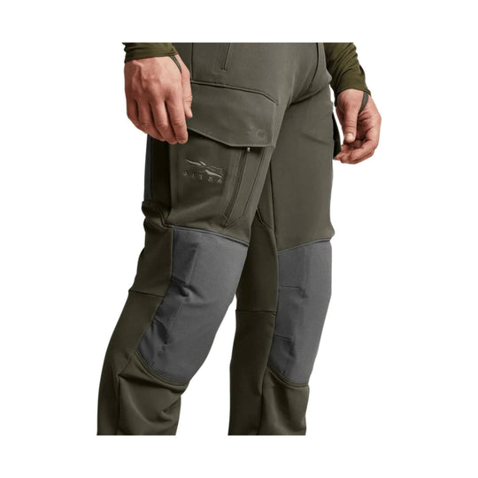 Olive and gray technical pants with reinforced knees and zip thigh pocket