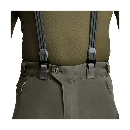 Olive technical pants with suspenders, belt loops, and zippered pockets
