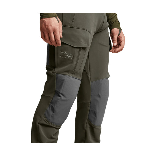 Olive and gray hunting pants with reinforced knees, zip thigh pocket, and SITKA logo