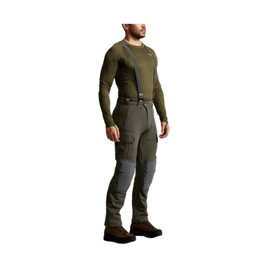 Olive hunting pants with suspenders, cargo pockets, and reinforced knee panels