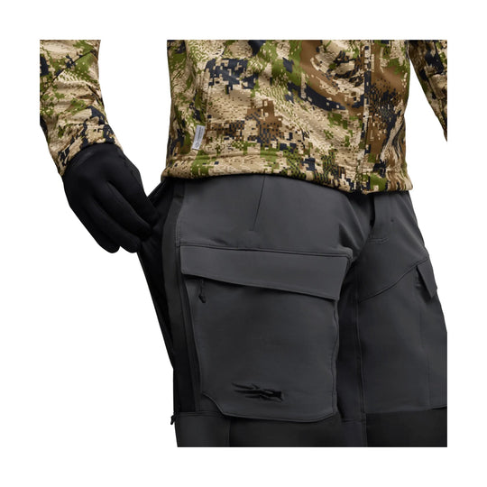 Camouflage long-sleeve pants with large cargo pockets and black gloves