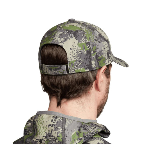 Camo baseball cap shown from the back on a model