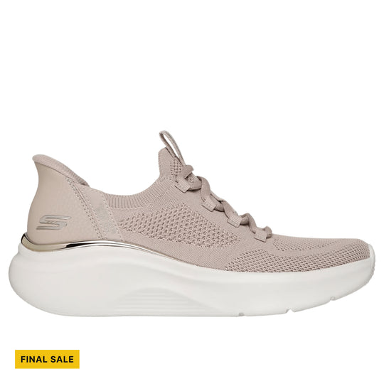 Taupe knit sneaker with thick white platform sole and visible side logo, shown in profile.