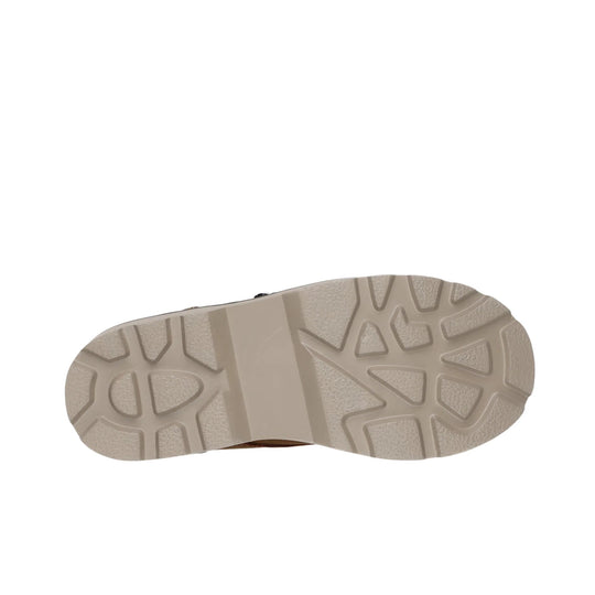 Beige treaded boot sole viewed from below
