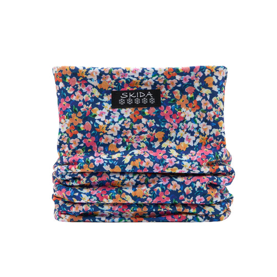 Floral patterned fleece neck warmer with a black Skida label