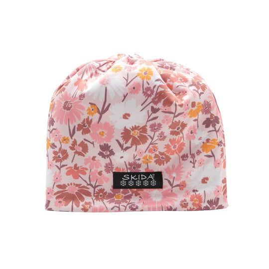 Pink floral knit beanie with a black SKIDA logo patch