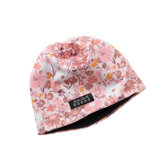 Pink floral knit beanie with a black SKIDA label