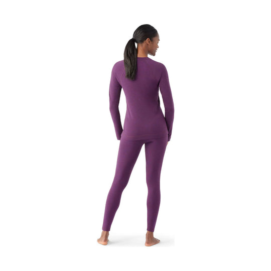 Purple long-sleeve thermal base layer top and matching leggings shown from the back