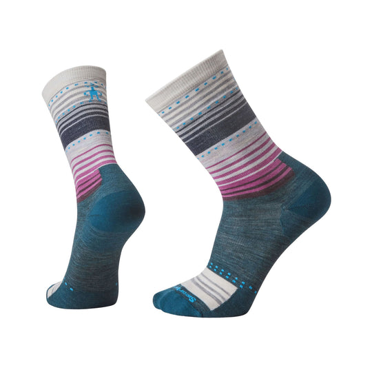 Pair of patterned crew socks in gray, teal, pink, and blue with striped cuffs