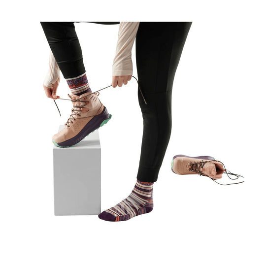 Striped mid-crew hiking socks shown with hiking boots being laced