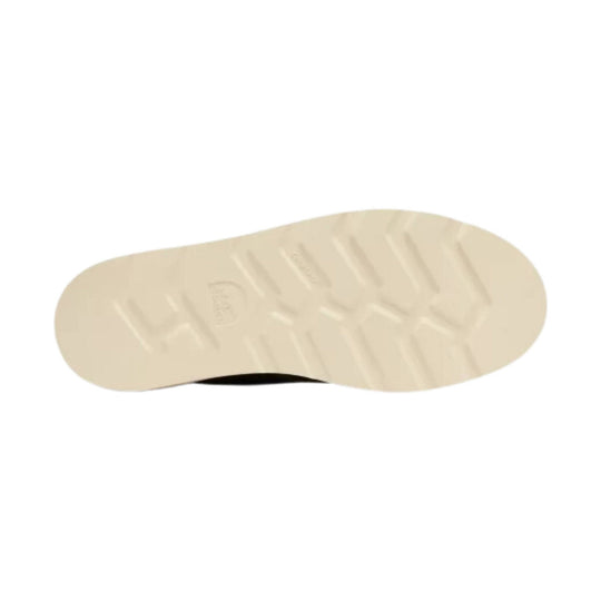 Beige rubber boot outsole with tread pattern and faint logo embossing