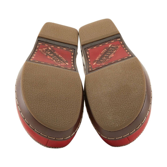 Pair of brown and red shoe soles with textured tread and visible brand labels
