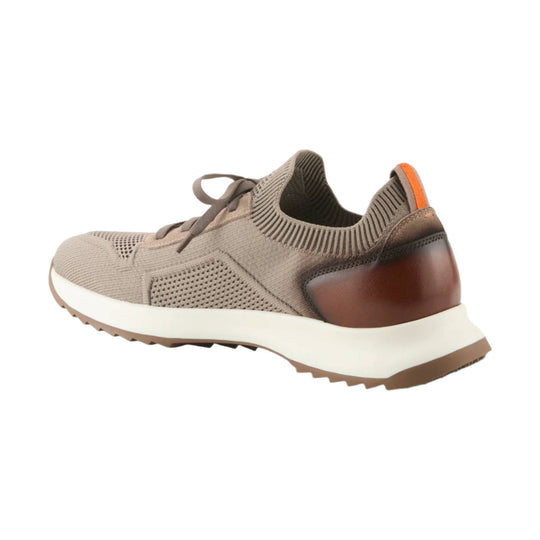 Taupe knit sneaker with gray laces, orange heel tab, and white sole, shown in side view