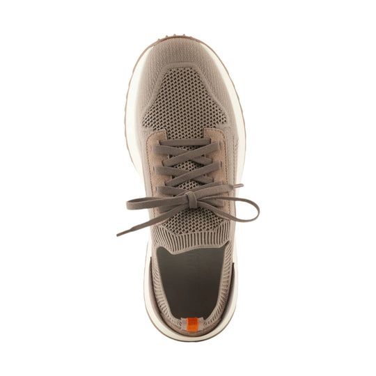 Taupe knit sneaker with mesh panels, flat laces, and a white sole, top view