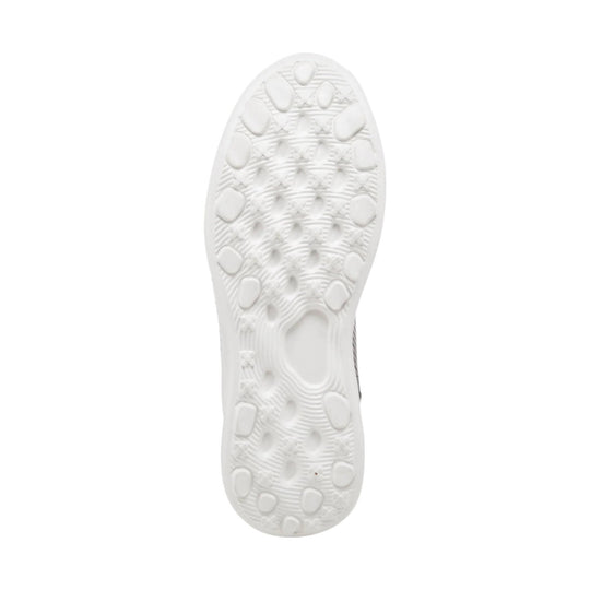 White sneaker outsole with oval tread pods and textured grip pattern