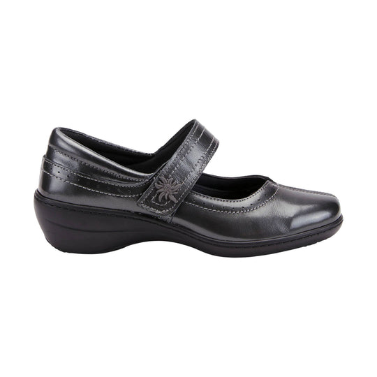 Black leather Mary Jane comfort shoe with a strap, perforated detailing, and a low wedge heel