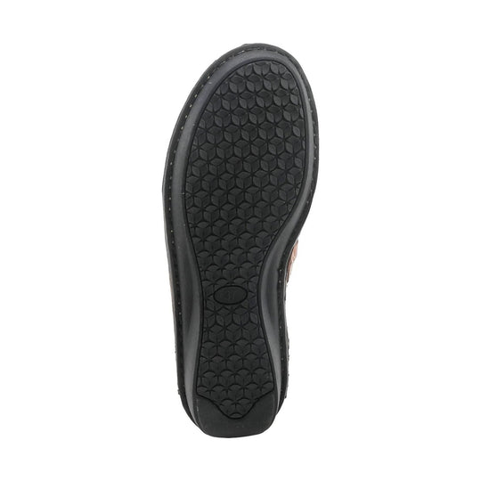 Black shoe outsole with textured floral tread pattern, viewed from below