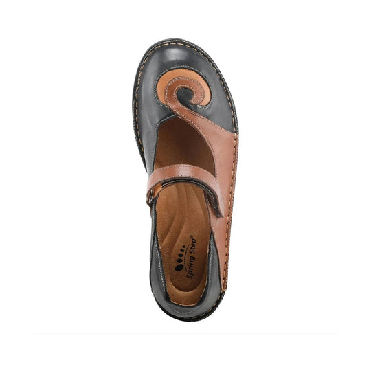 Black and tan closed-toe Mary Jane shoe with a swirl toe design and Velcro strap