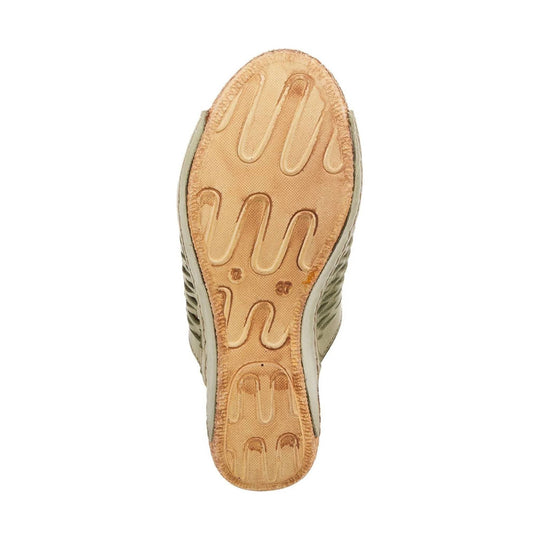 Olive and tan sandal outsole viewed from below with textured tread and side cutouts