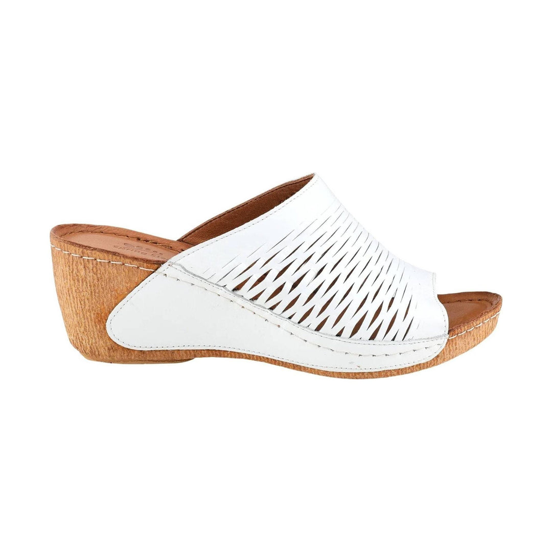 White peep-toe wedge slide sandal with cutout upper and cork-textured heel