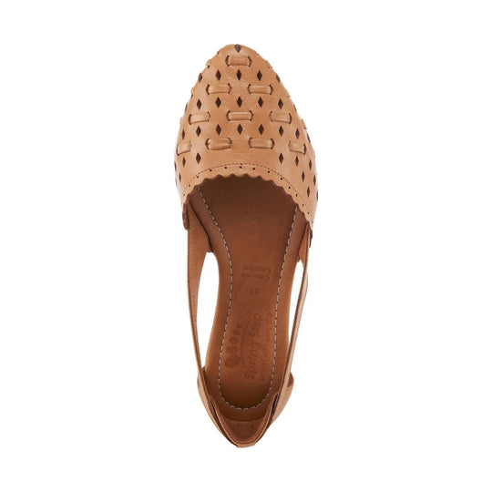 Camel leather slingback flat with closed toe, woven cutout pattern, and low wedge heel