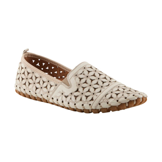 Cream closed-toe flat shoe with floral cutout pattern and tan sole