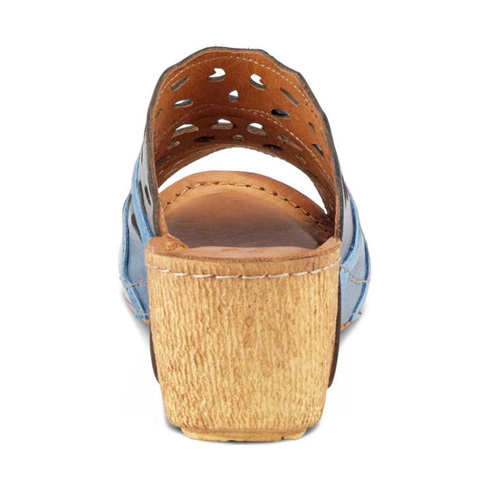 Blue and tan wedge sandal seen from the back, with a cutout leather upper and textured cork-look heel