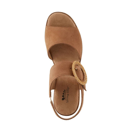 Tan suede slingback sandal with a closed toe, wide cutout straps, and a woven circular buckle detail