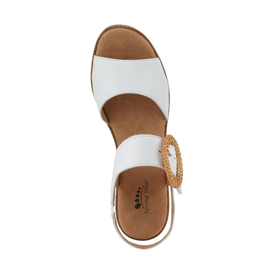 White sandal with tan footbed and woven buckle strap