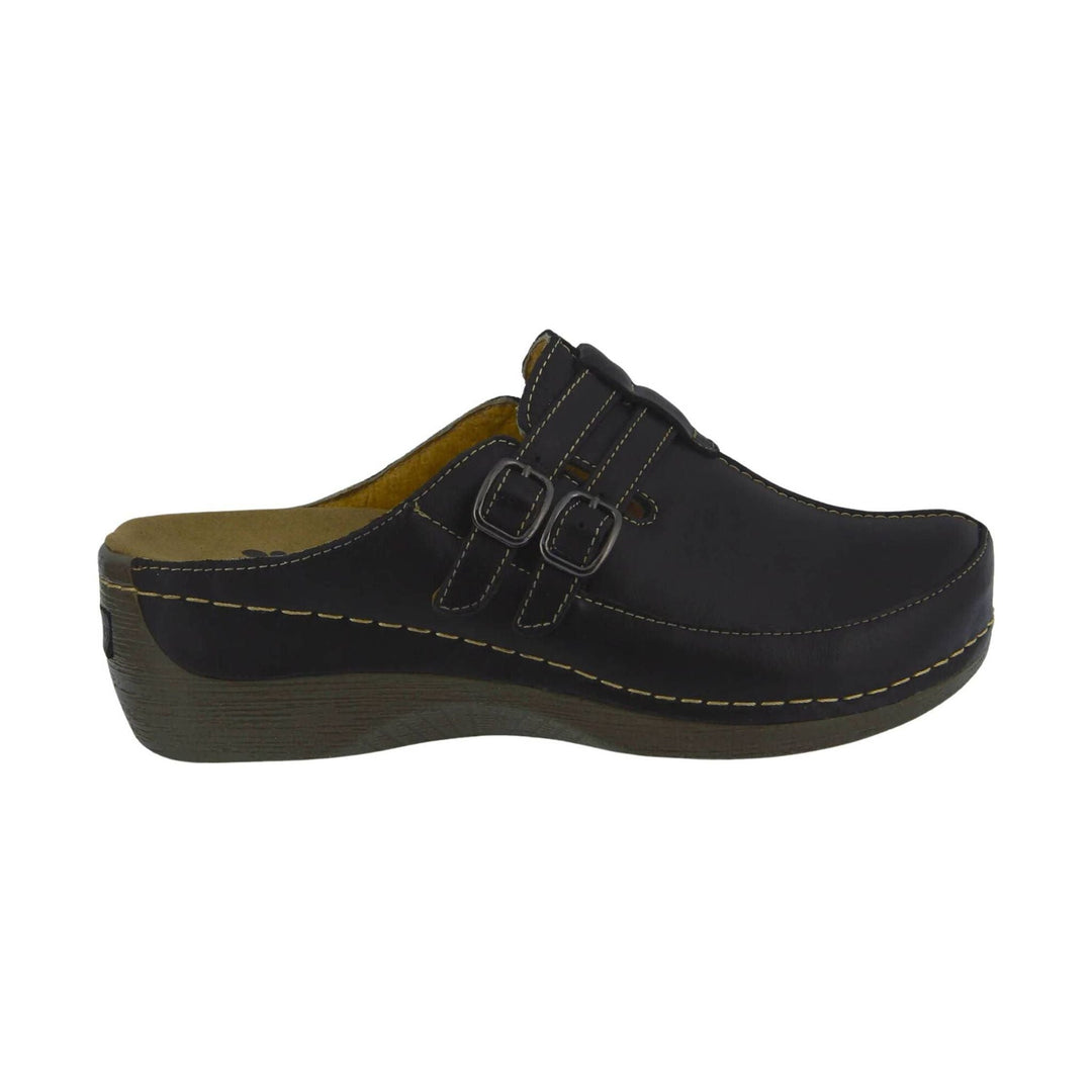 Black clogs with double buckle straps and a tan footbed