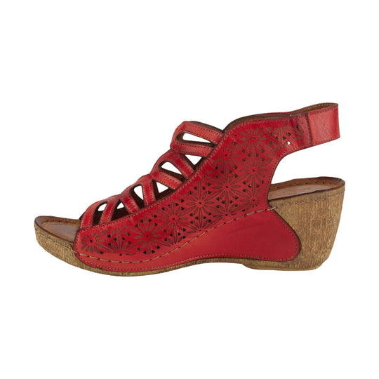 Red leather wedge sandal with floral cutouts and a slingback heel strap
