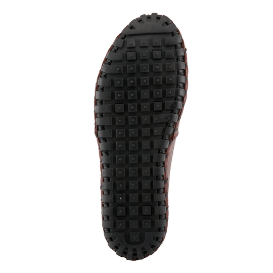 Black lugged shoe sole with square tread blocks and brown leather edges