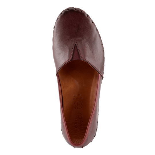 Burgundy leather closed-toe slip-on shoe, top view, with stitched seam and visible insole text