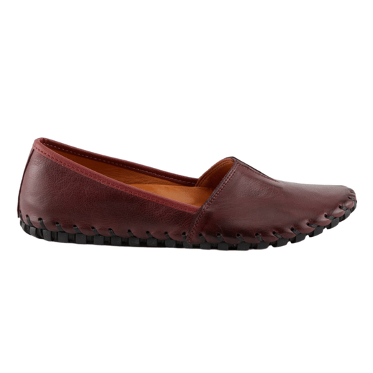 Burgundy leather slip-on flat with moccasin-style stitching and black rubber sole