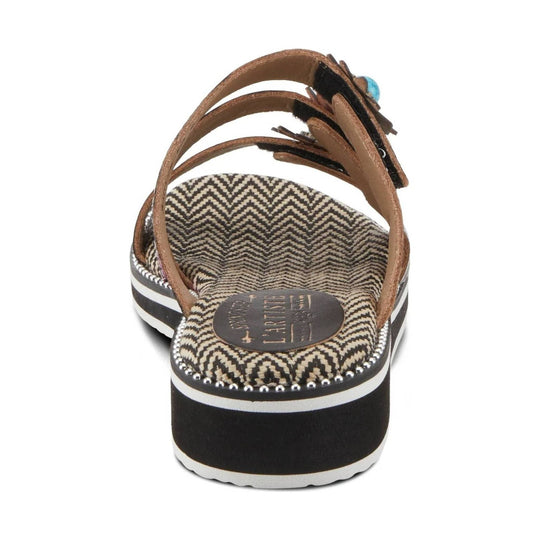 Brown and black platform sandal with zigzag footbed, braided straps, and decorative bead trim