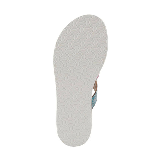 White patterned sandal sole with partial blue and tan strap visible