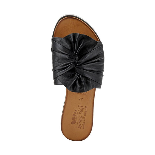 Black slide sandal with a gathered bow-style strap and tan footbed, top view
