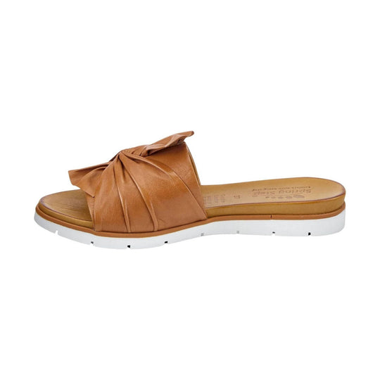 Tan leather slide sandal with knotted upper and white treaded sole