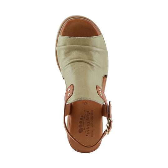 Beige closed-toe sandal with brown leather accents, slingback strap, and printed insole text