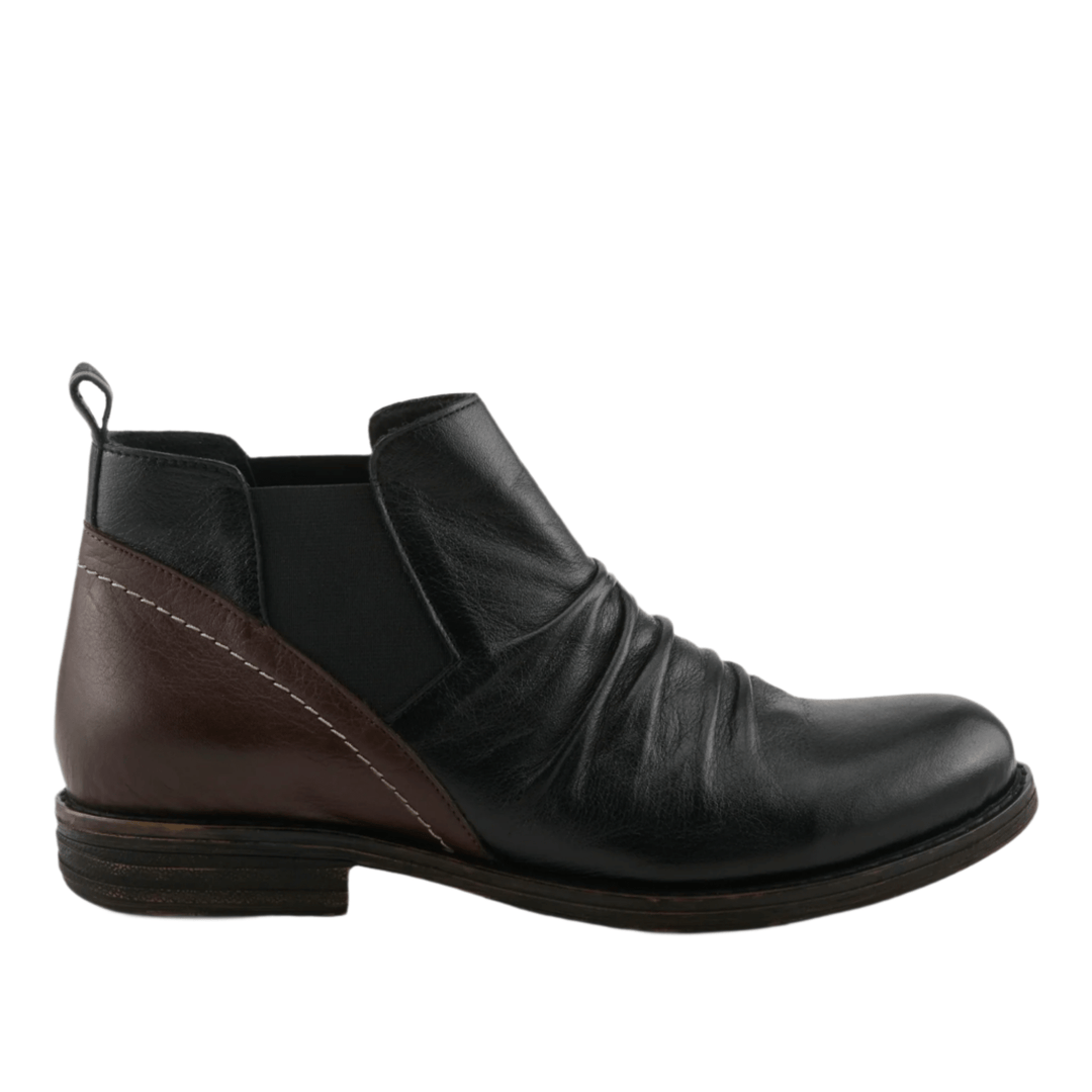 Black and brown ankle boot with a leather upper, side elastic panel, and pull loop at the heel