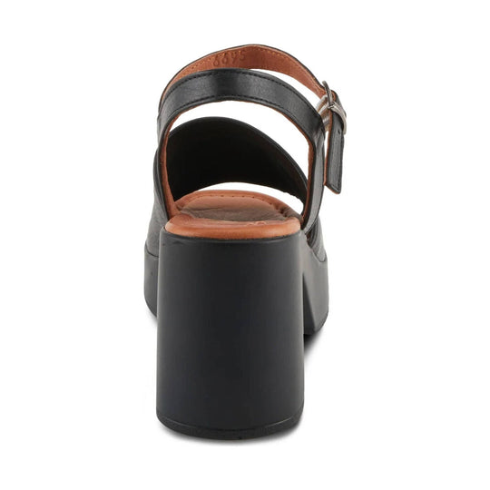 Black heeled sandal with tan footbed and ankle strap, shown from the back