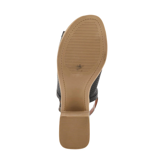 Black perforated sandal with tan sole, viewed from the bottom