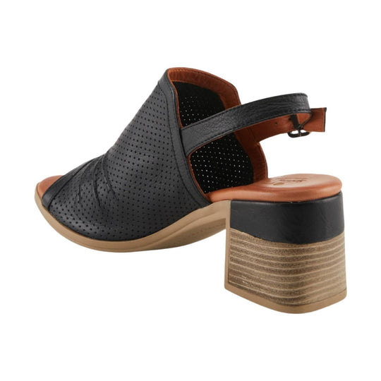 Black perforated heeled sandal with tan footbed and block heel, shown from the back side
