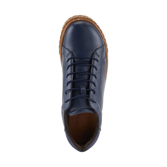 Navy lace-up shoe with a tan lug sole, top view